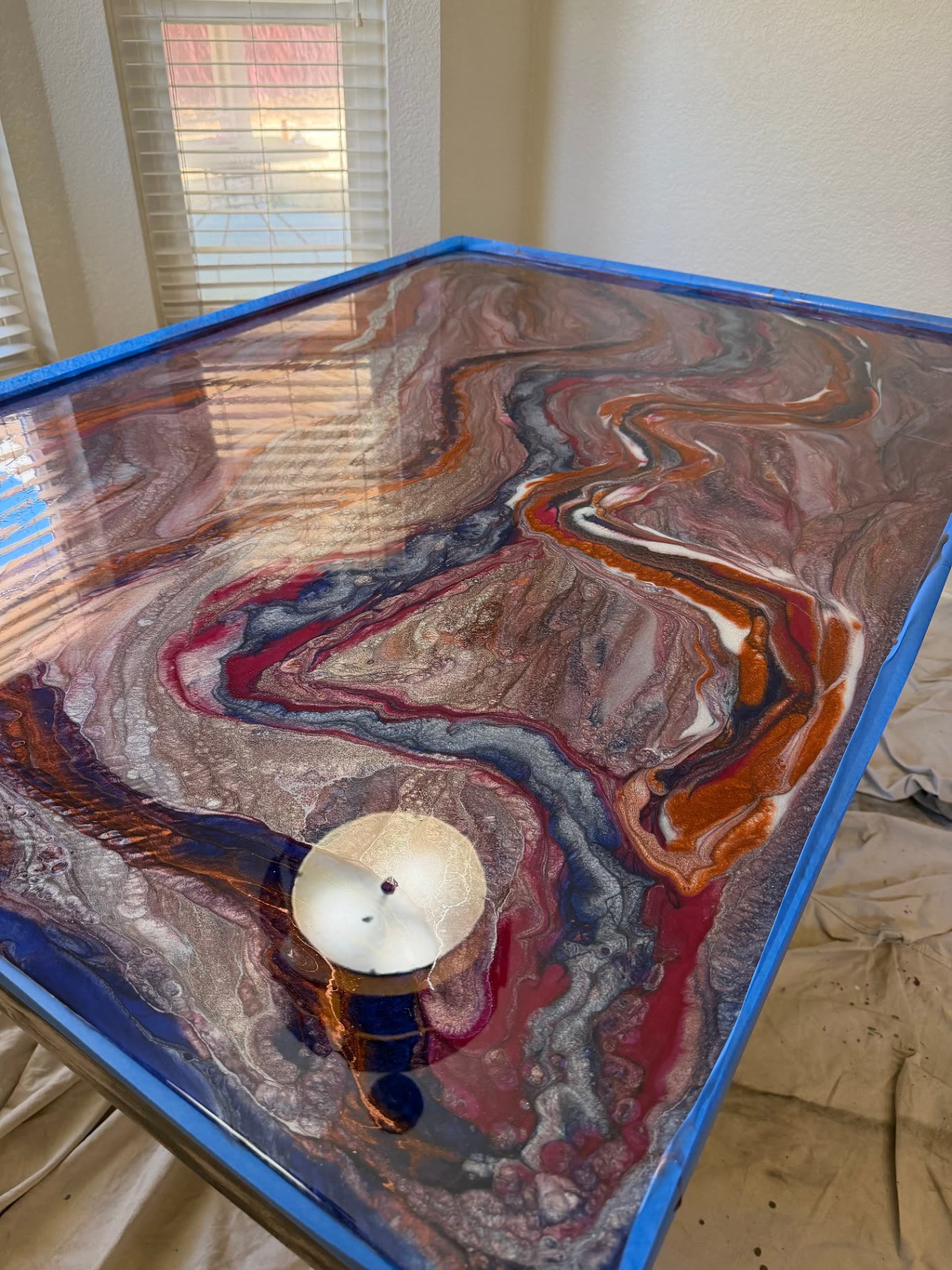 Copper, navy and burgundy epoxy resin table top with sand dollar inlay